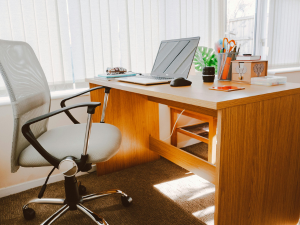 empty desk with a laptop