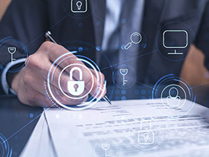A business professional signing a document with digital cybersecurity icons overlayed, representing secure documentation, compliance, and risk management in cybersecurity.